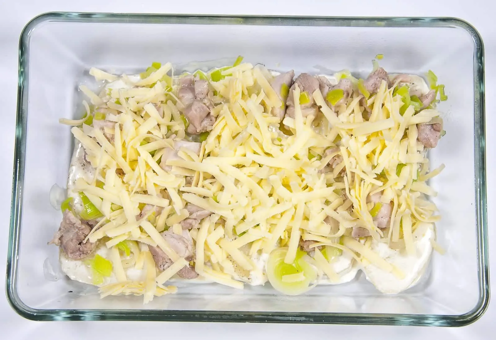 Chicken and Leek Dauphinoise. Add the cheese | https://theyumyumclub.com/2019/06/03/chicken-leek-dauphinoise/