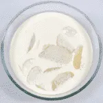Chicken and Leek Dauphinoise. Add the cream to the potatoes | https://theyumyumclub.com/2019/06/03/chicken-leek-dauphinoise/