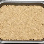 Flatten the flapjack mixture | https://theyumyumclub.com/2019/06/01/extra-soft-and-chewy-flapjacks/