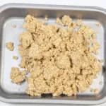 Tip the flapjack mixture into a baking tray | https://theyumyumclub.com/2019/06/01/extra-soft-and-chewy-flapjacks/