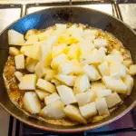 Add the potatoes | https://theyumyumclub.com/2019/06/24/bavarian-potato-salad-bacon/