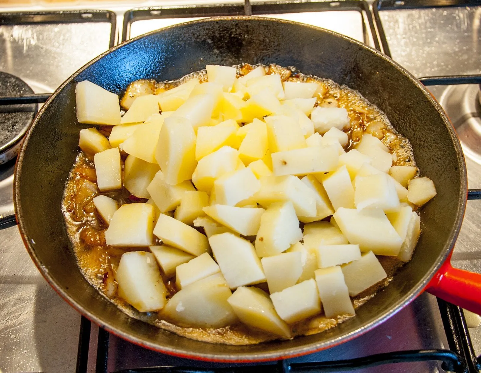 Add the potatoes | https://theyumyumclub.com/2019/06/24/bavarian-potato-salad-bacon/