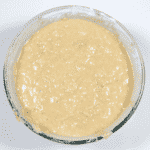Fold the mix into the flour. Humble Hummingbird Cake With Sweet Pecan Dust | https://theyumyumclub.com/2019/06/05/humble-hummingbird-cake-sweet-pecan-dust/