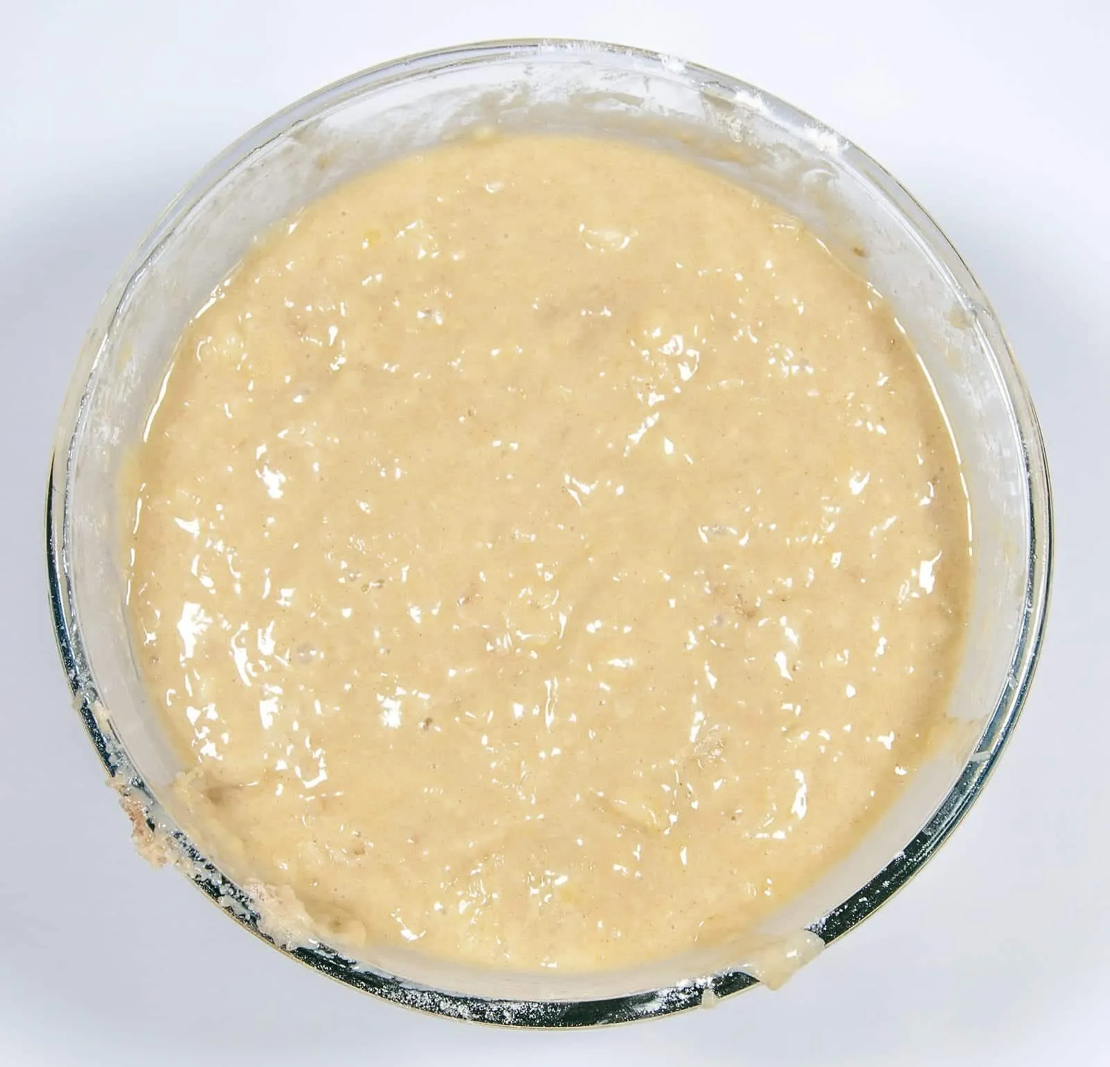 Fold the mix into the flour. Humble Hummingbird Cake With Sweet Pecan Dust | https://theyumyumclub.com/2019/06/05/humble-hummingbird-cake-sweet-pecan-dust/