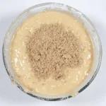 Add the chopped pecans. Humble Hummingbird Cake With Sweet Pecan Dust | https://theyumyumclub.com/2019/06/05/humble-hummingbird-cake-sweet-pecan-dust/