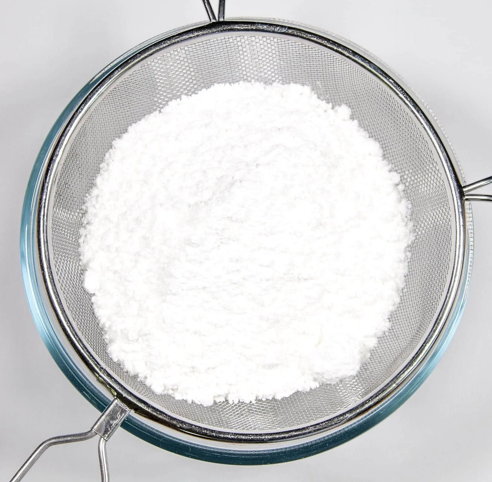 Sieve the icing sugar. Humble Hummingbird Cake With Sweet Pecan Dust | https://theyumyumclub.com/2019/06/05/humble-hummingbird-cake-sweet-pecan-dust/