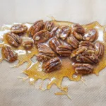 Pecan brittle. Humble Hummingbird Cake With Sweet Pecan Dust | https://theyumyumclub.com/2019/06/05/humble-hummingbird-cake-sweet-pecan-dust/