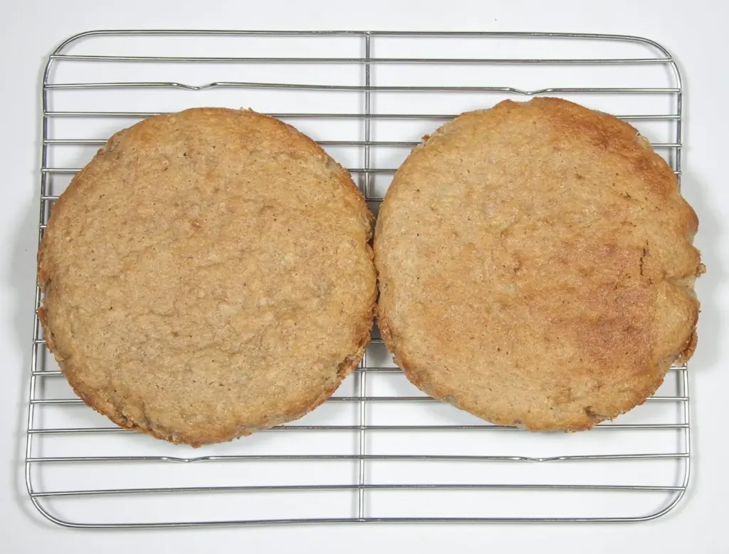 Place on cooling wires. Humble Hummingbird Cake With Sweet Pecan Dust | https://theyumyumclub.com/2019/06/05/humble-hummingbird-cake-sweet-pecan-dust/