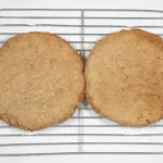 Place on cooling wires. Humble Hummingbird Cake With Sweet Pecan Dust | https://theyumyumclub.com/2019/06/05/humble-hummingbird-cake-sweet-pecan-dust/
