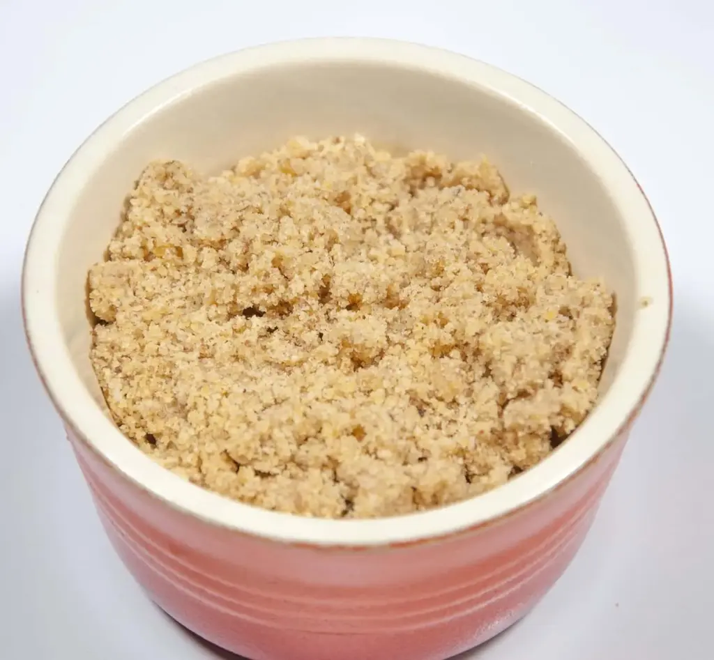Pecan brittle. Humble Hummingbird Cake With Sweet Pecan Dust | https://theyumyumclub.com/2019/06/05/humble-hummingbird-cake-sweet-pecan-dust/