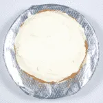 Add the top and cover. Humble Hummingbird Cake With Sweet Pecan Dust | https://theyumyumclub.com/2019/06/05/humble-hummingbird-cake-sweet-pecan-dust/