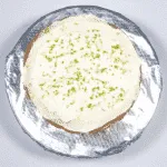 Grate over some line zest. Humble Hummingbird Cake With Sweet Pecan Dust | https://theyumyumclub.com/2019/06/05/humble-hummingbird-cake-sweet-pecan-dust/