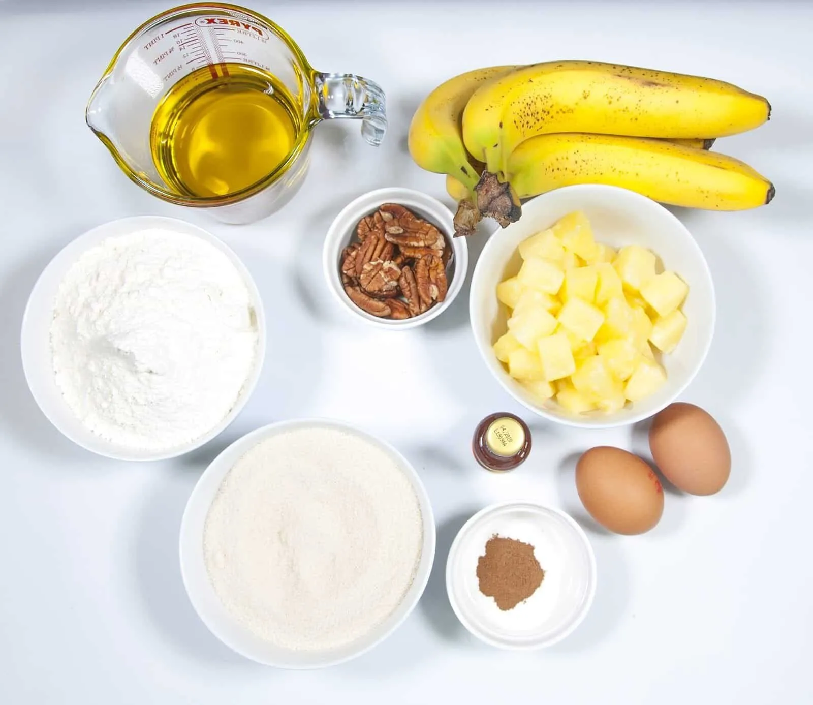 Gather the ingredients together. Humble Hummingbird Cake With Sweet Pecan Dust | https://theyumyumclub.com/2019/06/05/humble-hummingbird-cake-sweet-pecan-dust/