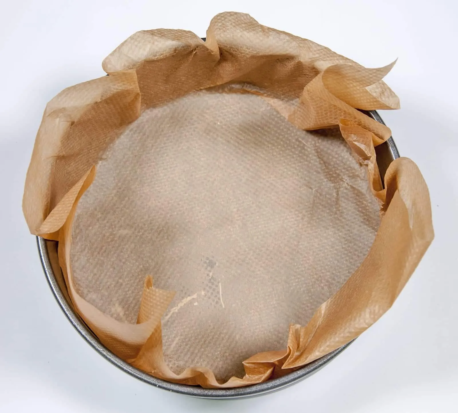 Line both cakes tins. Humble Hummingbird Cake With Sweet Pecan Dust | https://theyumyumclub.com/2019/06/05/humble-hummingbird-cake-sweet-pecan-dust/