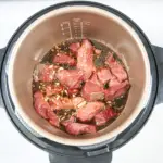 Pour over the sriracha sauce | https://theyumyumclub.com/2019/06/27/sriracha-beef-gangnam-style/