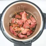 Pour over the sriracha sauce | https://theyumyumclub.com/2019/06/27/sriracha-beef-gangnam-style/