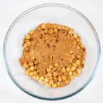 Add the spices | https://theyumyumclub.com/2019/06/18/moroccan-chickpea-salad/
