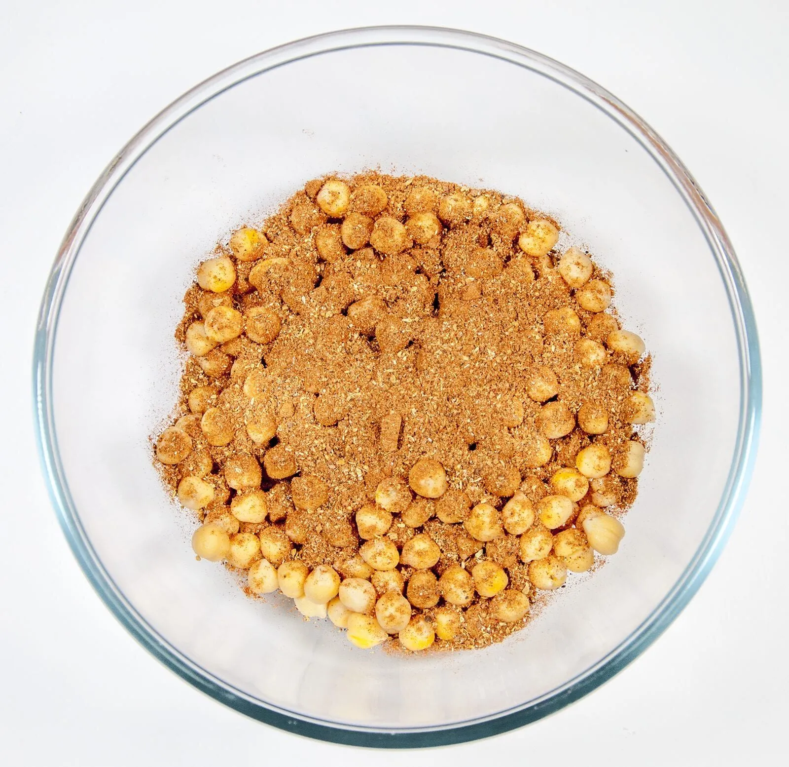 Add the spices | https://theyumyumclub.com/2019/06/18/moroccan-chickpea-salad/