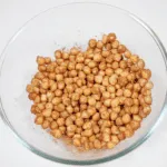 Mix in the spices | https://theyumyumclub.com/2019/06/18/moroccan-chickpea-salad/