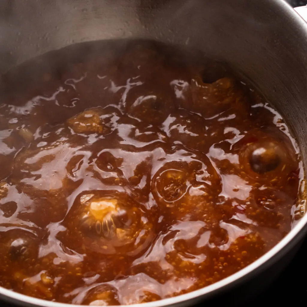 Add the chicken stock, 2 tbsp. Soy Sauce, Thai Chili Sauce, and fish sauce