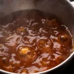 Add the chicken stock, 2 tbsp. Soy Sauce, Thai Chili Sauce, and fish sauce