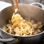 Add the cooked pasta and stir to combine.
