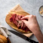 Season with garlic powder, salt and pepper