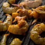 cook the prawns until sticky and fully cooked.