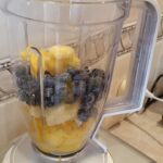 Banana, Mango and Blueberry Smoothie - all ingredients in the blender